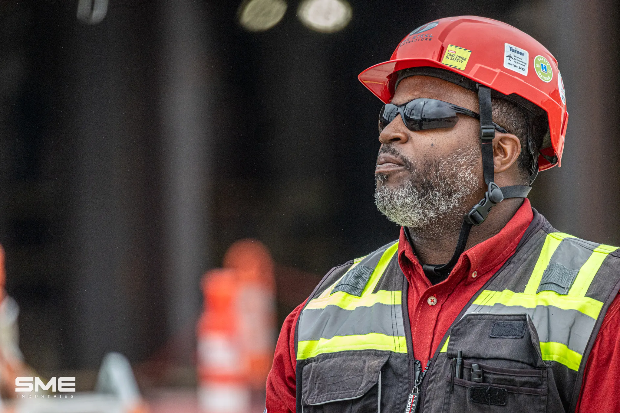 man in hardhat, safety glasses and safety vest